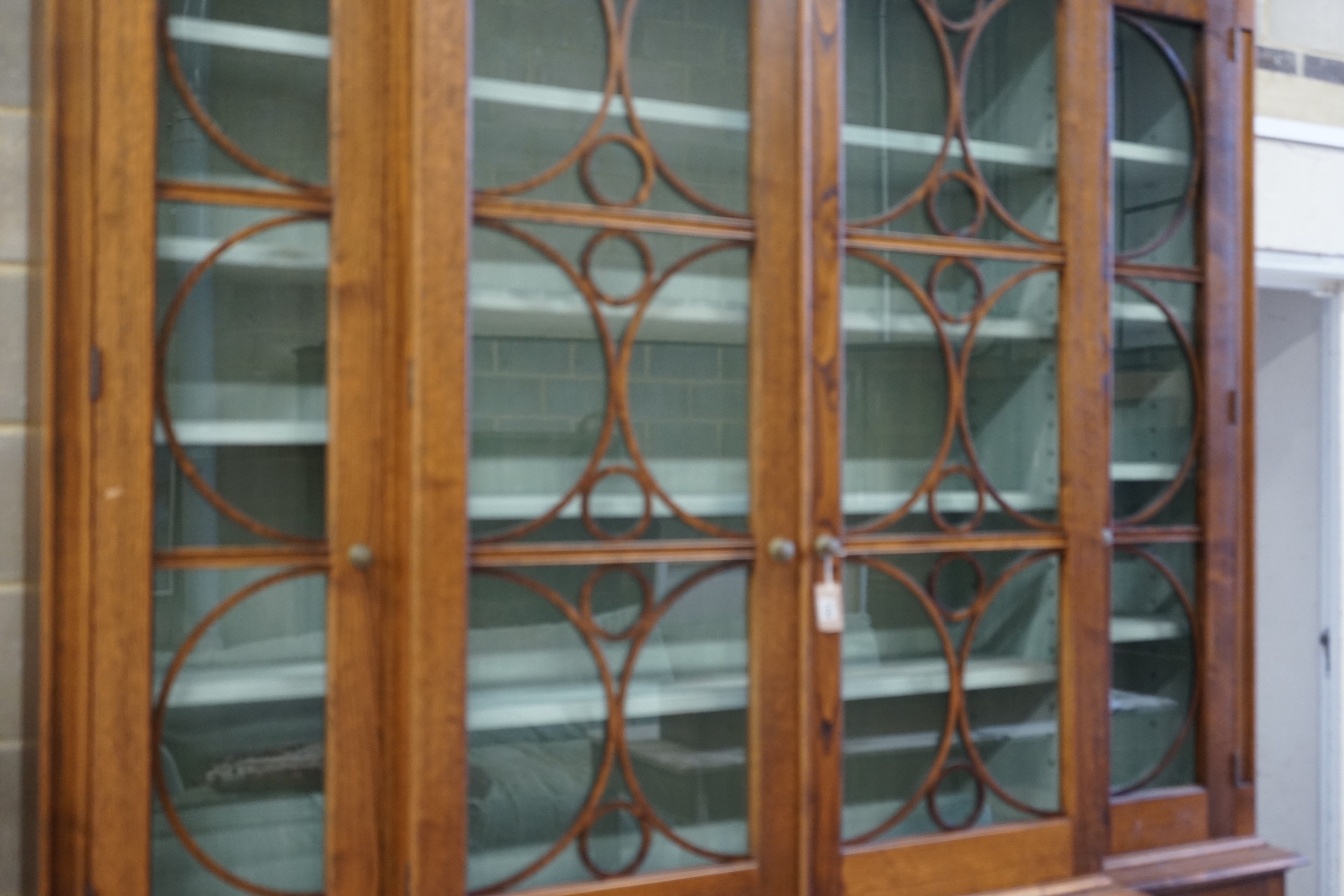 A William Yeoward Cherington chestnut breakfront bookcase, width 220cm, depth 49cm, height 295cm